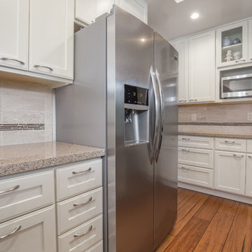 Medium Hardwood Floors Compliment Simple White Contemporary Kitchen