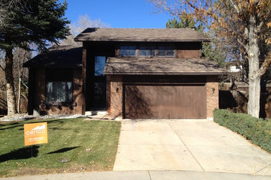 Inspiration for a large timeless two-story gable roof remodel in Denver
