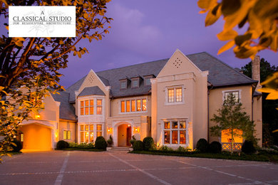 Huge traditional yellow three-story mixed siding exterior home idea in Atlanta