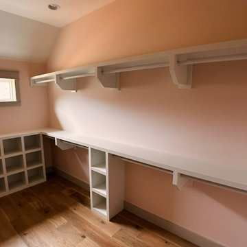 Elegant Guest Closet Organization: White Built-Ins, Open Cubbies, and Hanging St