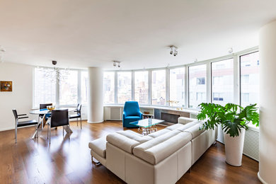 Inspiration for a huge modern formal and open concept light wood floor living room remodel in New York with white walls, a standard fireplace and a metal fireplace