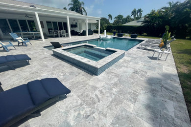 Inspiration for a transitional backyard pool landscaping remodel in Miami with decking