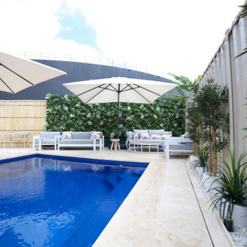 A Stunning Poolside With Artificial Green Walls and Plants