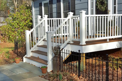 Inspiration for a small timeless blue two-story vinyl house exterior remodel in Other with a hip roof and a shingle roof