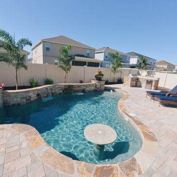 Custom Swimming Pool with Granite Tabletop and Spillway