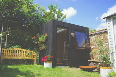 This is an example of a medium sized contemporary detached office/studio/workshop in Kent.