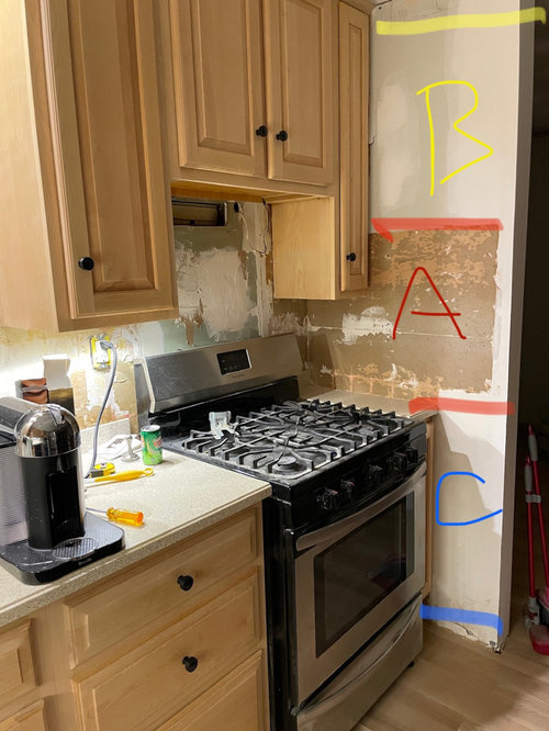 Quartz backsplash placement on awkward wall.