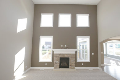 This is an example of a contemporary family room in Grand Rapids.