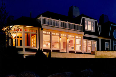 Large trendy brown two-story wood exterior home photo in Philadelphia