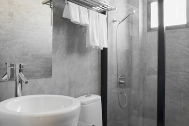 Bathroom - mid-sized modern 3/4 concrete floor bathroom idea in Los Angeles with flat-panel cabinets, concrete countertops and gray walls