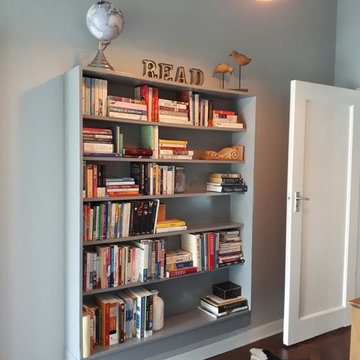 This old bookshelf was brown and placed too high on the opposite wall. Painted