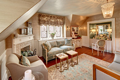 Example of a mid-sized classic master dark wood floor and brown floor bedroom design in New York with a corner fireplace, gray walls and a tile fireplace