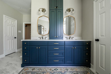 Inspiration for a transitional bathroom remodel in Houston with blue cabinets