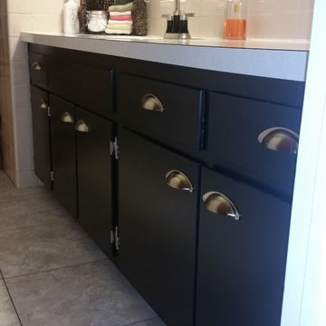 Vanity Cabinets painted in black.