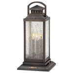Hinkley - Revere 3-Light Outdoor Light In Blackened Brass - Revere is a traditional coach lantern in solid brass with clear seedy glass panels. The glass, faux candle sleeves and classic candelabra bulbing complete the authentic appearance.  This light requires 3 , 4W Watt Bulbs (Not Included) UL Certified.