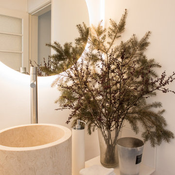 Casa da Moeda bathroom with stone basin and backlit mirror