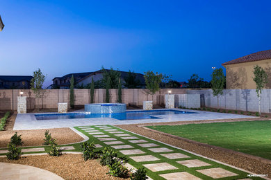 Large transitional pool photo in Phoenix
