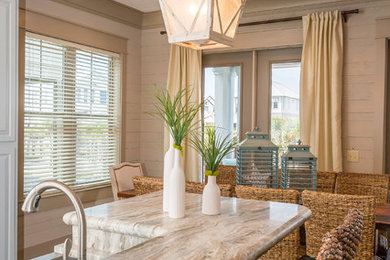 Beach style galley vinyl floor eat-in kitchen photo in Miami with gray cabinets, granite countertops, gray backsplash, stainless steel appliances and an island