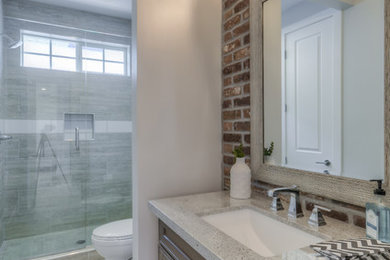 Example of an arts and crafts powder room design in Phoenix
