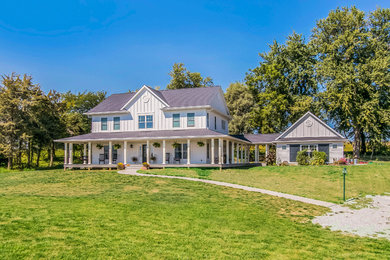Farmhouse white two-story gable roof idea in Cedar Rapids with a shingle roof