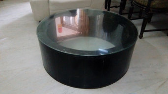 Round coffee table inside carved top glass