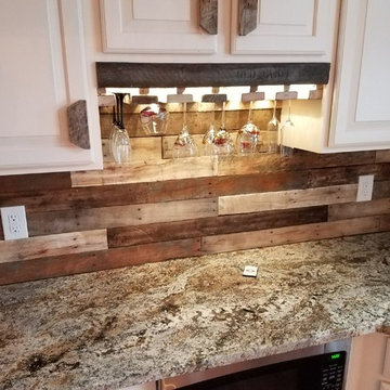 Custom Barnwood backsplash, kitchen accents, door and lighiting