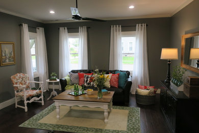 Small farmhouse open concept dark wood floor and brown floor living room photo in Indianapolis with gray walls and no tv