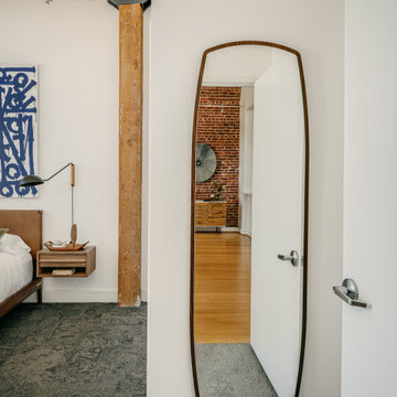 White Bedroom with Floating Nightstand, Wall-Mounted Swivel Lamps, Leather Headb
