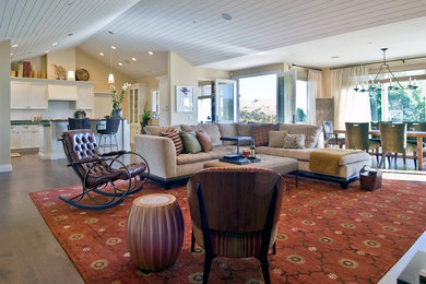 Huge transitional open concept and formal medium tone wood floor living room photo in San Francisco with beige walls, a standard fireplace, a stone fireplace and no tv
