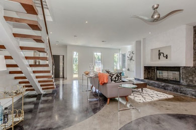 Inspiration for a large contemporary formal and open concept concrete floor living room remodel in DC Metro with white walls, a ribbon fireplace, a concrete fireplace and a wall-mounted tv