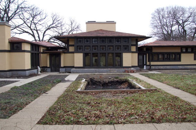 Large craftsman beige two-story exterior home idea in Chicago
