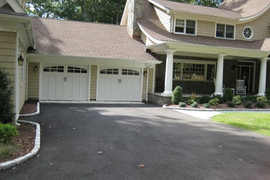 Example of a large arts and crafts beige two-story vinyl exterior home design in New York