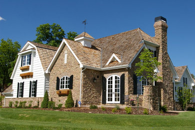 Example of a cottage exterior home design in Denver