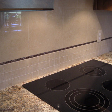 Exotic Granite wtih Dark Traditional Cabinets