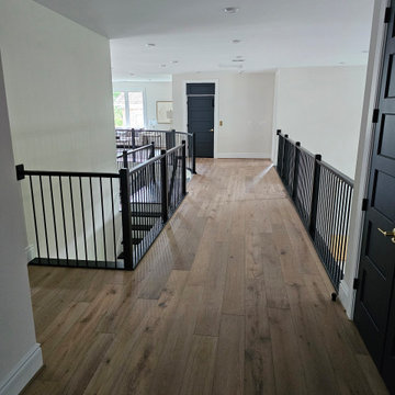 Project #130 | Curved Staircase with Wraparound Balcony