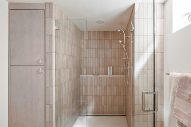 This is an example of a medium sized classic shower room bathroom in Portland with flat-panel cabinets, medium wood cabinets, a built-in shower, a two-piece toilet, white tiles, porcelain tiles, white walls, porcelain flooring, a submerged sink, engineered stone worktops, white floors, a hinged door, white worktops, a single sink and a floating vanity unit.