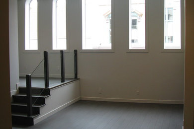 Living room - contemporary open concept medium tone wood floor living room idea in Toronto with white walls
