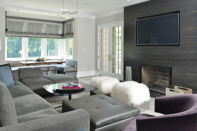Inspiration for a mid-sized modern open concept gray floor living room remodel in New York with gray walls and a media wall