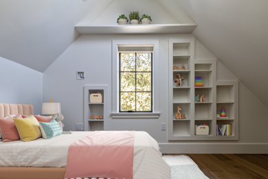 Inspiration for a small cottage gender-neutral medium tone wood floor, brown floor and vaulted ceiling kids' room remodel in Vancouver with white walls