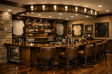 Example of a classic home bar design in Orange County with recessed-panel cabinets