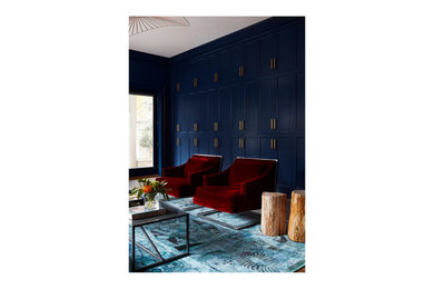 Inspiration for a contemporary family room remodel in Chicago with blue walls and a media wall