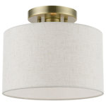 Livex Lighting - Blossom 1 Light Antique Brass Small Semi-Flush - The Meadow collection is both modern and versatile. The hand-crafted fabric oatmeal colored hardback shade is set off by the silky white fabric on the inside setting a pleasant mood. The small size single-light drum shade adds character to this handsomely styled semi flush.  Perfect fit for the hallway, bathroom, kitchen and a small bedroom. This sleek design is shown in an antique brass finish.