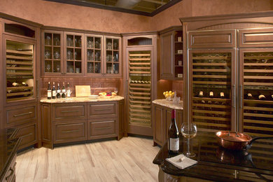 Photo of a mid-sized traditional wine cellar in Boston with light hardwood floors and storage racks.