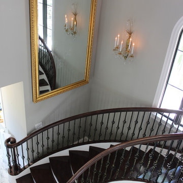 Walnut Circular Stair with Twist & Basket Iron Balusters