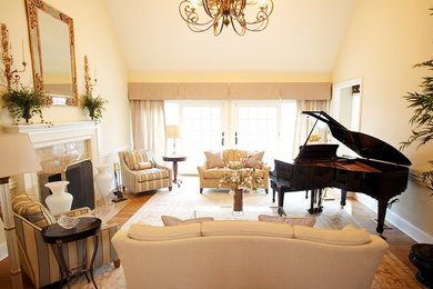 Small elegant enclosed medium tone wood floor and brown floor living room photo in New York with a music area, beige walls, a standard fireplace, a tile fireplace and no tv
