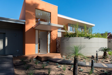 Modelo de fachada de casa gris minimalista grande de una planta con revestimientos combinados y tejado de metal