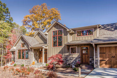 Inspiration for a large rustic brown two-story mixed siding exterior home remodel in Other with a shingle roof