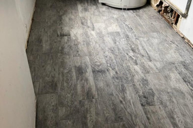 Inspiration for a mid-sized single-wall porcelain tile and gray floor dedicated laundry room remodel in Orange County