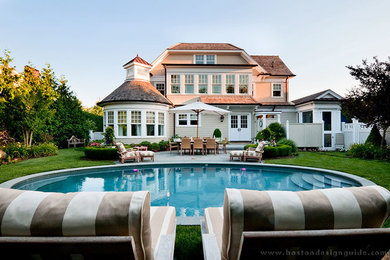 Inspiration for a mid-sized backyard natural pool remodel in Boston