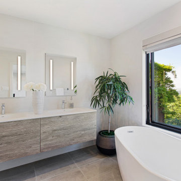 Floating and free-standing tub in the primary bathroom